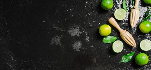 Fresh limes. On black table.
