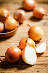 Fresh onions on table .