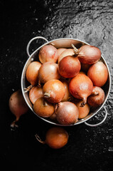 Fresh onions . On table