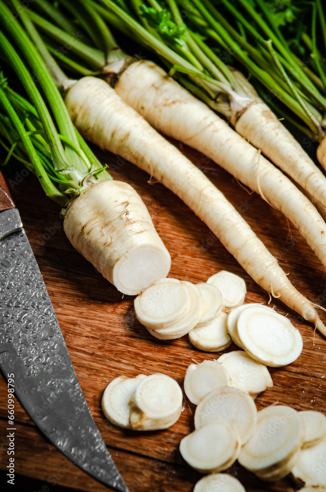 Poster chopped parsley root. on table