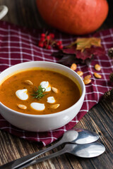 pumpkin soup. on a wooden background. gourmet. lunch .season