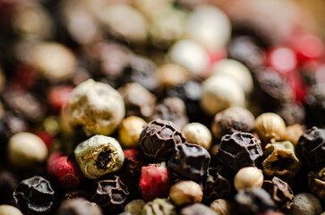 Peppercorn on rustic background.