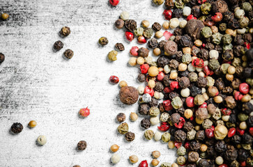 Peppercorn on rustic background.