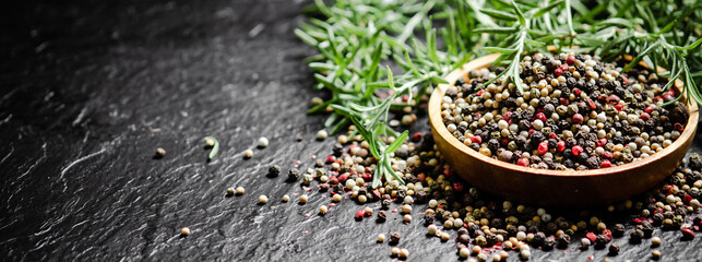 Peppercorn on rustic background.