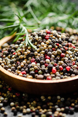 Peppercorn on rustic background.