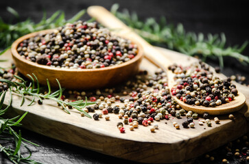 Peppercorn on rustic background.