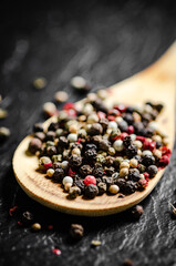 Peppercorn on rustic background.
