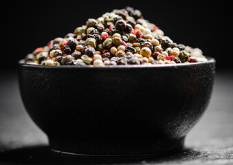 Peppercorn on rustic background.