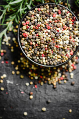 Peppercorn on rustic background.