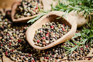 Peppercorn on rustic background.