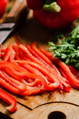 Chopped sweet pepper. On wooden table.