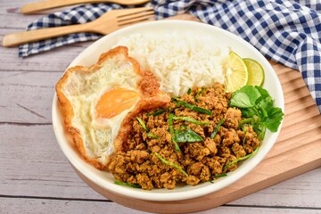 Southern stir-fried pork with yellow curry paste with rice and fried egg,thai food , top view table