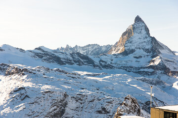 Snowy mountain Matterhorn during the day in winter. Zermatt, swiss alps