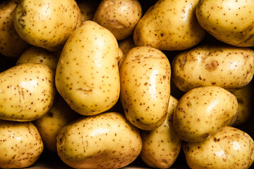 Fresh potatoes in box . Top view.