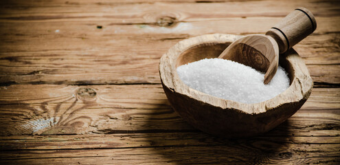 Salt background . On wooden table.