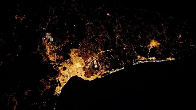 Night lights city of Antalya, Turkey. Aerial satellite view of travel destination, animation based on image by Nasa