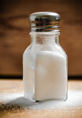 Salt background . On wooden table.