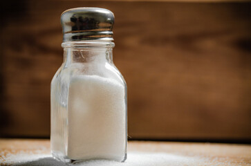 Salt background . On wooden table.