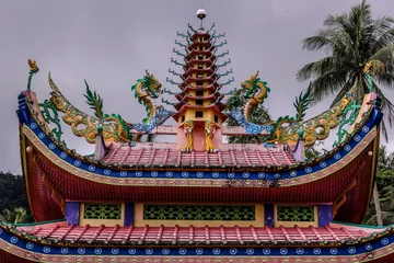 Fototapeten buddhist temple roof © Rendi