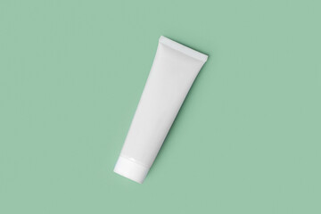 White Cream Package Template on Color Studio Green Background. Natural Cosmetics Showing. Beauty Product Mockup. Skincare, Facial mask, Toner. Front View Soft Shadow. Trendy Bottle. Spa Anti-aging