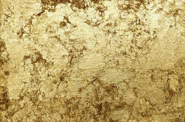 Gold background. Gold metallic texture. Trendy template for holiday.