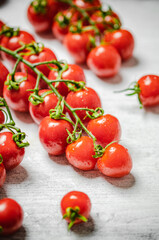 Fresh tomatoes. On white table.