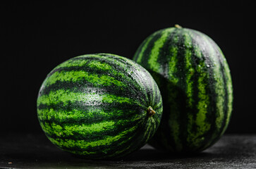 Fresh watermelons on table .