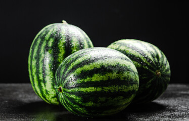 Fresh watermelons on table .