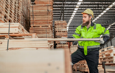 Fototapeta premium Determined woodworker measures, shapes, and balances wood with precision using hand and power tools