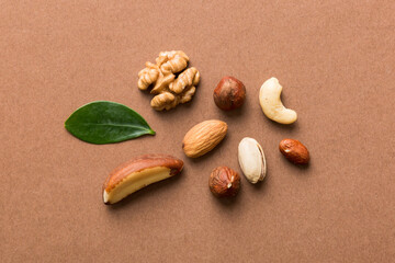 Composition of nuts , flat lay - mix hazelnuts, cashews, almonds on table background. healthy eating concepts and food background
