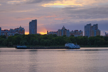Picturesque view of embankment of Obolon in Kyiv with modern skyscrapers against sunset sky. Travel and tourism concept