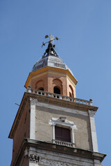 Modena, Italy. View of Cathedral with Ghirlandina tower located on Piazza Grande at dusk