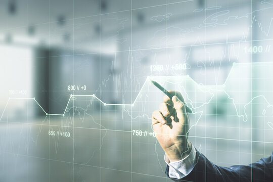 Multi exposure of male hand with pen working with abstract statistics data hologram interface on blurred office background, computing and analytics concept - Powered by Adobe