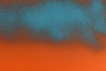 blue spray paint on orange paper background