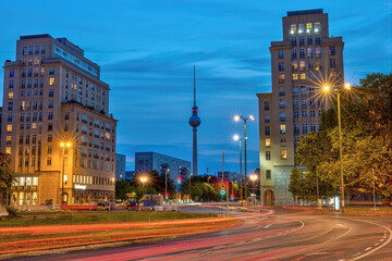 Fototapeta na wymiar The Strausberger Platz in Berlin with its stalinistic architecture at dusk