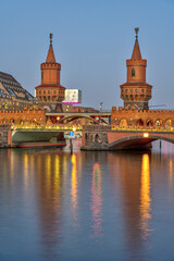 The towers of the beautiful Oberrbaumbruecke in Berlin at twilight