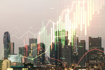Double exposure of abstract creative financial chart hologram on Los Angeles skyscrapers background, research and strategy concept