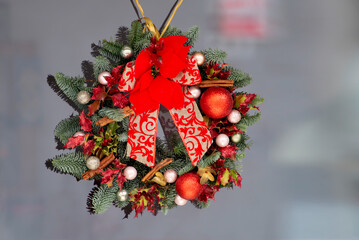 Christmas wreath of branches of a Christmas tree, white,gold and red balls,cinnamon,bow,red...