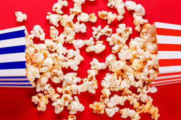cardboard box with popcorn on a red background