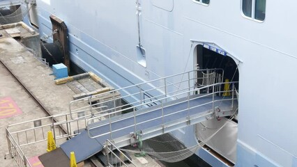 view to the gangway boarding bridge to the passenger cruise ship area with out any passenger, disemarkation cruise ship bridge way to the port