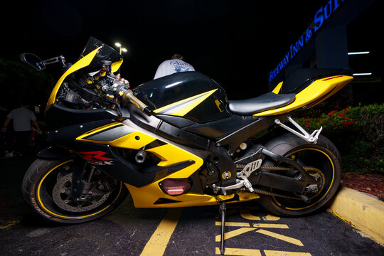 Night stock image of a yellow and black Suzuki gsxr sport bike motorcycle
