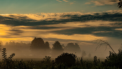 Obraz premium Morning fog at sunrise over the Suprasl River in Podlasie.