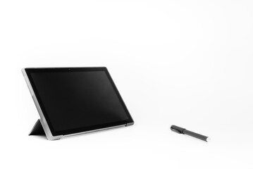 Tablet and pen on a white background. EBook. Isolated.