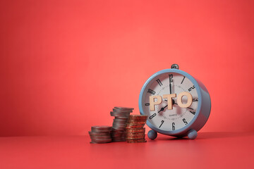 A concept on PTO or paid time off. The letter PTO was pasted on the face of the alarm clock. Stacked coins. Copy space for text, messages, information, etc. - obrazy, fototapety, plakaty