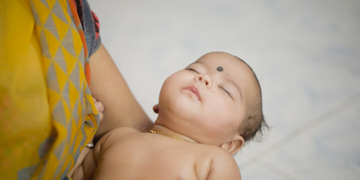 Massage For The Baby three Month Baby slpeeing Stock Photo, indian Baby massage stock images