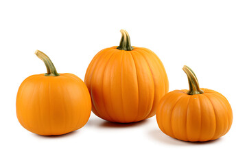 A group of three pumpkins sitting on a white background
