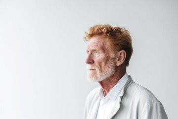 Obraz premium senior old man thinking with pensive expression against wall background. 