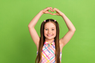 Photo of lovely charming girl wear trendy clothes two hands above head demonstrate heart shape...