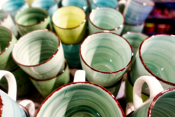 close up image of a set of different colored cups