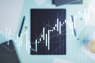 Multi exposure of abstract financial diagram and modern digital tablet on background, banking and accounting concept